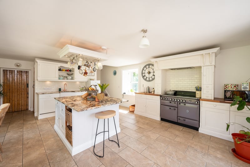 The recently refurbished kitchen is a great space for entertaining in. Out of view are elegant French doors leading to a new external decking.