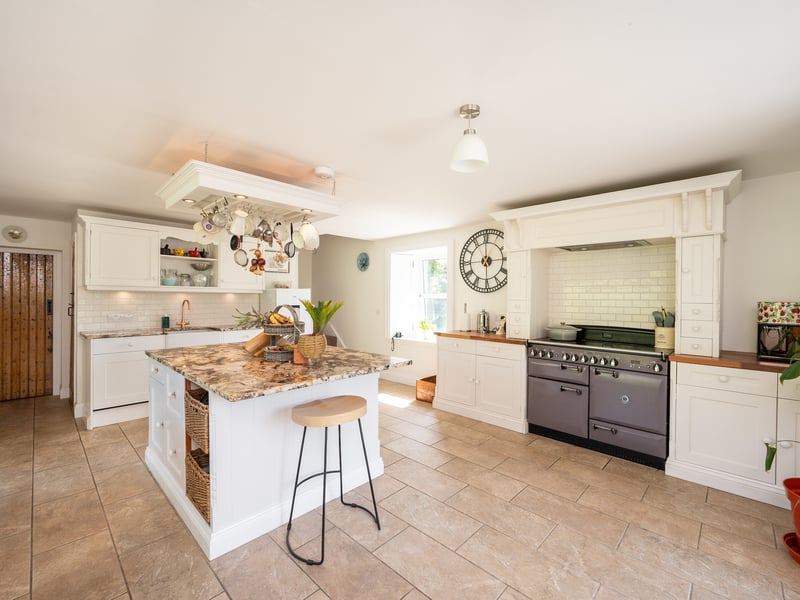 The recently refurbished kitchen is a great space for entertaining in. Out of view are elegant French doors leading to a new external decking.