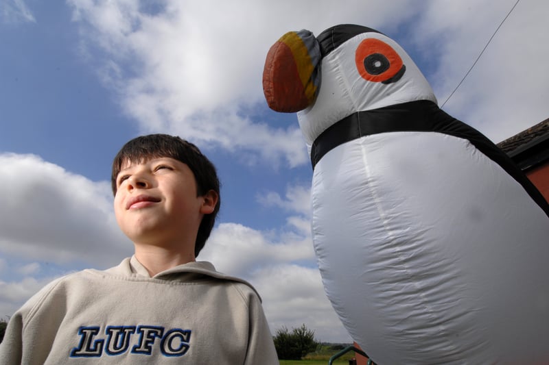 Young Cameron Rhodes-Williams is pictured with a giant inflatable puffin at Rodley Nature Reserve in August 2007. The puffin visited to raise awareness of the precarious future facing marine wildlife.