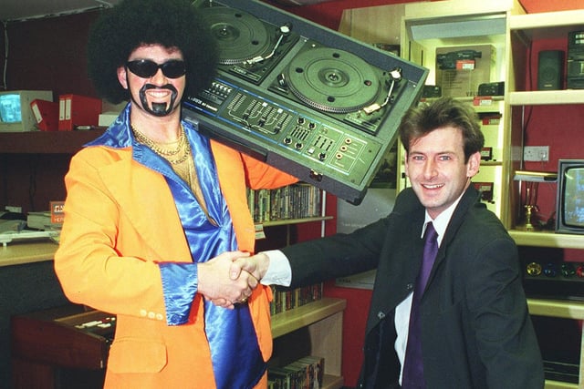 Lionel Vinyl picks up a couple of decks at Cash Transformers on the corner of Church Street and Regent Road. He is pictured with proprietor Mark Massey