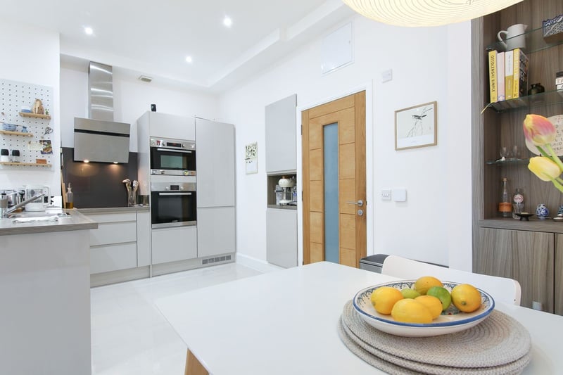 There is a feature split-level work-space or dining area and the quality fitted kitchen boasts integrated appliances.