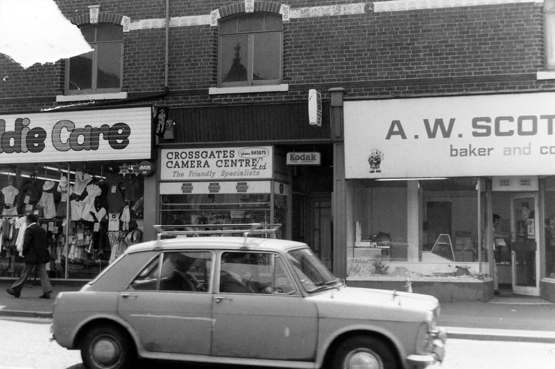 Part of a parade of shops on Austhorpe Road, showing from left, No.8 Kiddie Care children's centre, No.6 Crossgates camera centre and No.4 A.W.Scott, baker and confectioner.  Pictured in  June 1980.