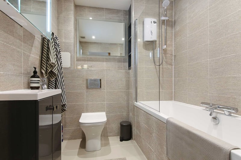 Situated on the lower floor, the luxury bathroom with shower is modern and very presentable. 