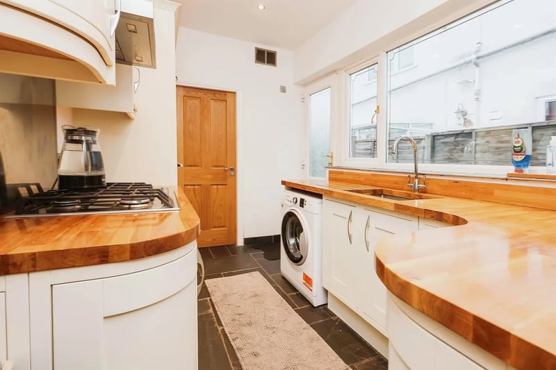The kitchen has double glazed window to the side, this room consists of wall and base units, an electric oven, microwave and a gas hob with an extractor hood.