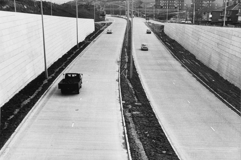 A view of a section of the Stanningley Bypass looking towards Leeds from the bridge on Swinnow Road. Pictured in March 1971.