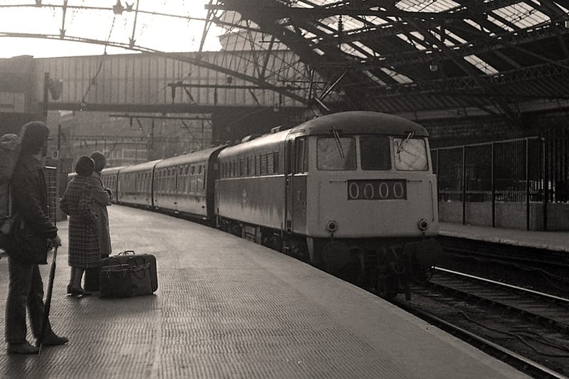 Commuters wait for a train in Liverpool Lime Street station in 1976.