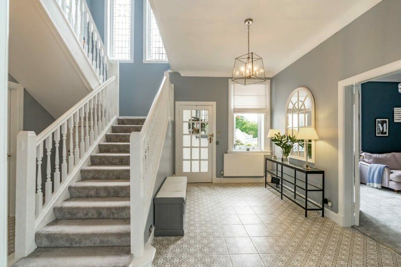 You are met with a bright and spacious hallways as you enter the property with a beautiful staircase. 