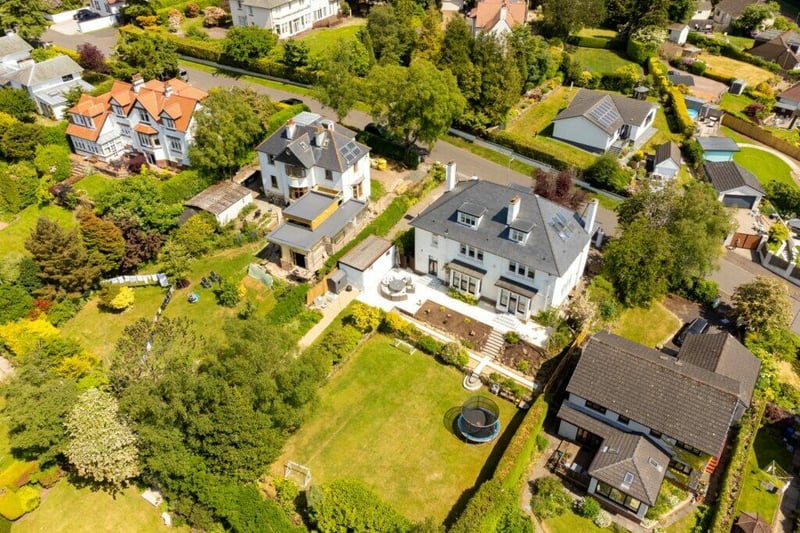 An aerial view of the property which showcases the stunning gardens. 