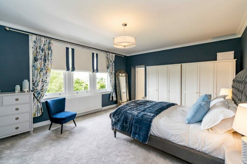 The impressive principal bedroom is a fabulous size and features a large three pane window 