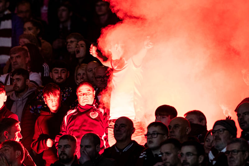 Supporters set off pyrotechnics during the League Cup semi-final between Rangers and Hearts at Hampden.