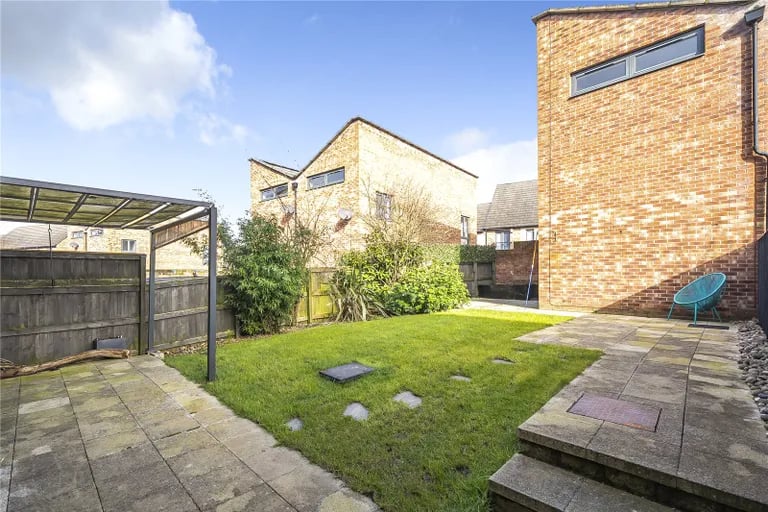 To the rear sits a fully enclosed and private landscaped garden.
