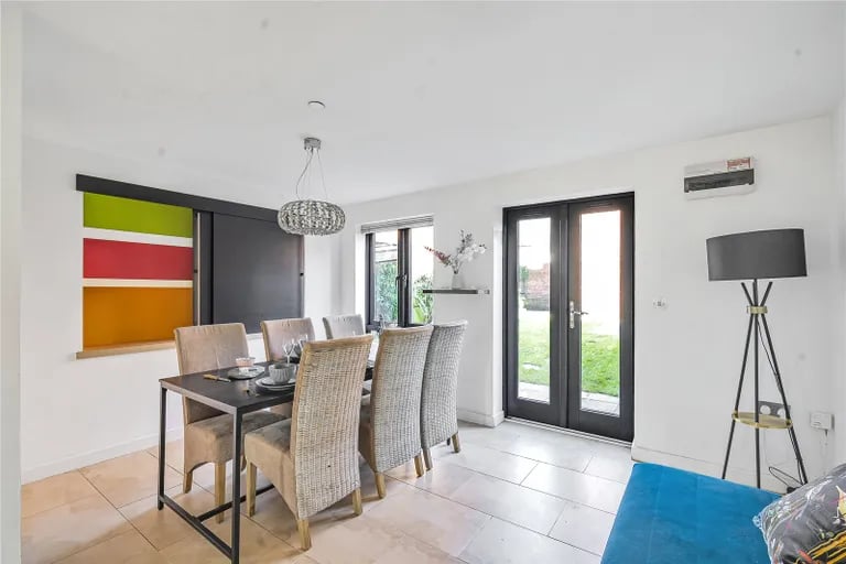This elegant space also features doors onto the rear garden.