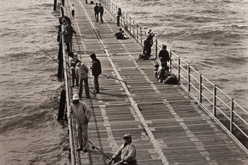 Anglers fishing from the jetty in August 1981