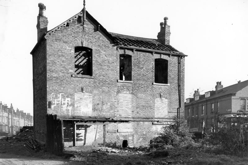 Number 8 Burton Road, a large detached house in derelict condition. The house is facing towards what had been the garden (garages had been erected on the site), with Burton Road behind. On the opposite side of Burton Road, Fairford Terrace is on the left, Primrose Lane to the right. Pictured in October 1967. 