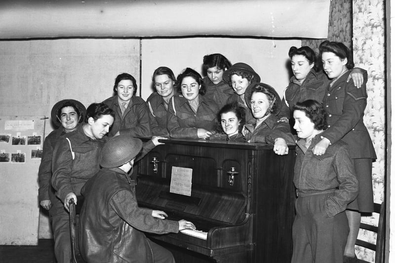 These ATS members had time for a singsong during a brief moment of calm in the Second World War.
