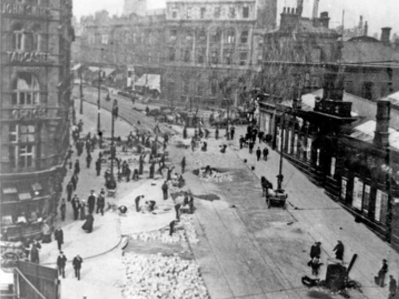 Tram tracks being laid along High Street, Sheffield, from Fitzalan Square, with Marples Hotel (left) and Fitzalan Market (right), some time between 1900 and 1919