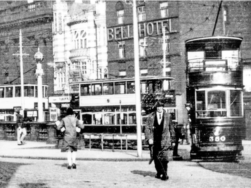 Fitzalan Square pictured some time between 1920 and 1939, with Barclays Bank, the News Theatre and Bell Hotel in the background