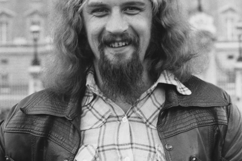 Scottish comedian Billy Connolly in front of Buckingham Palace during a visit to London in July 1974.  