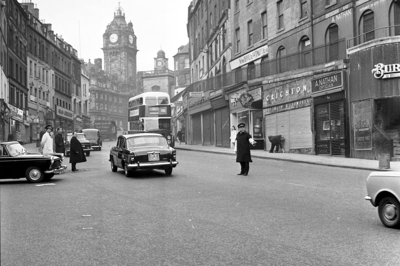 A traffic warden directs the traffic in Leith Street Edinburgh in April 1969.
