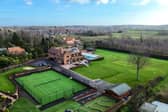 This incredible mega-mansion has tennis courts, mini-golf, a huge pool, expansive grounds and a model of The Hulk all within its gates and walls