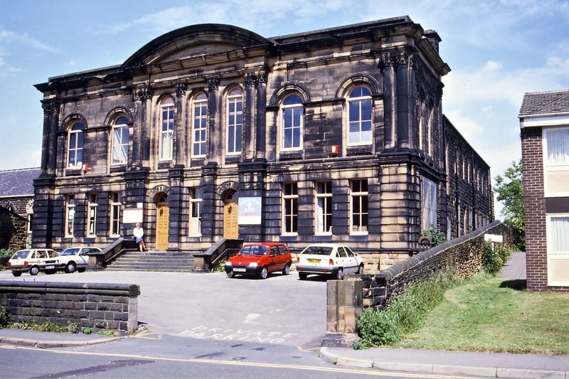 The Sunday School building of the United Reformed Church of St. Mary's-in-the-Wood in July 1994. By this time the whole of the grassland and trees within the walled enclosure had been cleared and the area tarmaced for a car park. This had been done partly because the building had been used as a junior establishment for Wakefield Tutorial College for nearly 50 years by this time, but also because the large church further along Commercial Street was becoming too costly to heat in the depths of winter and so services were then held in the Sunday School building. 