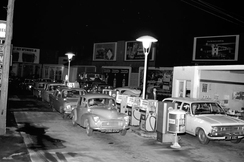 Cars line up at a petrol station in a last-minute attempt to fill up before the Budget changes in November 1968