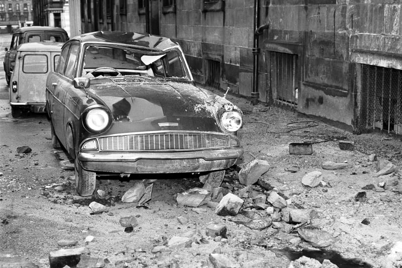 Cars, including this Ford Anglia, were damaged by falling masonry during January gales in Edinburgh in 1968.