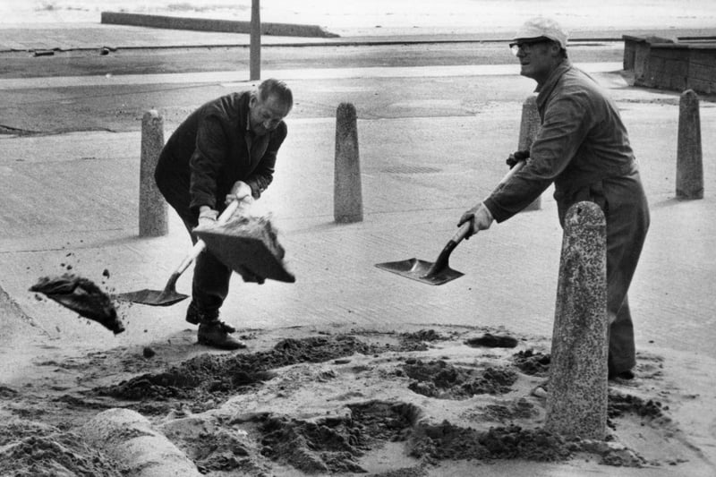 Council workmen in South Shields were shovelling sand from the road back onto the beach in this June 1981 photo.