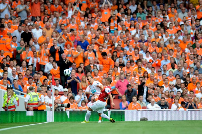 David Vaughan clears his lines in front of the Blackpool fans inside the away end at the Emirates in 2010