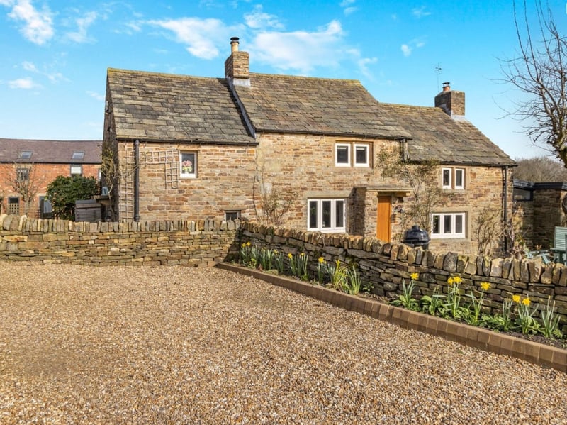 This three bedroom cottage is the central accommodation on the plot.