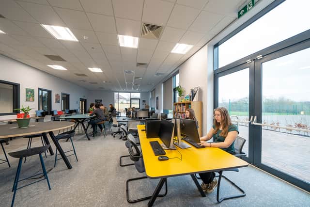 The new sixth form building features 15 classrooms, a giant wall-to-floor glass study room, a "university feel" and "stunning views" over the countryside."