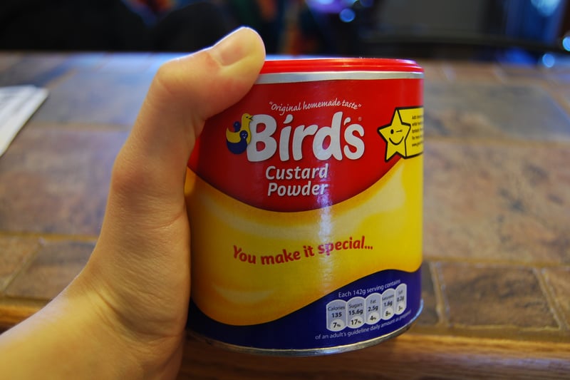 Bird’s Custard, invented by Birmingham’s Alfred Bird in 1837, was born out of necessity. His wife’s egg allergy prompted him to create a custard recipe without eggs. The original Bird’s Custard headquarters now houses independent shops, cafes, and restaurants in Birmingham. Today, this beloved dessert topping is enjoyed by families worldwide. 