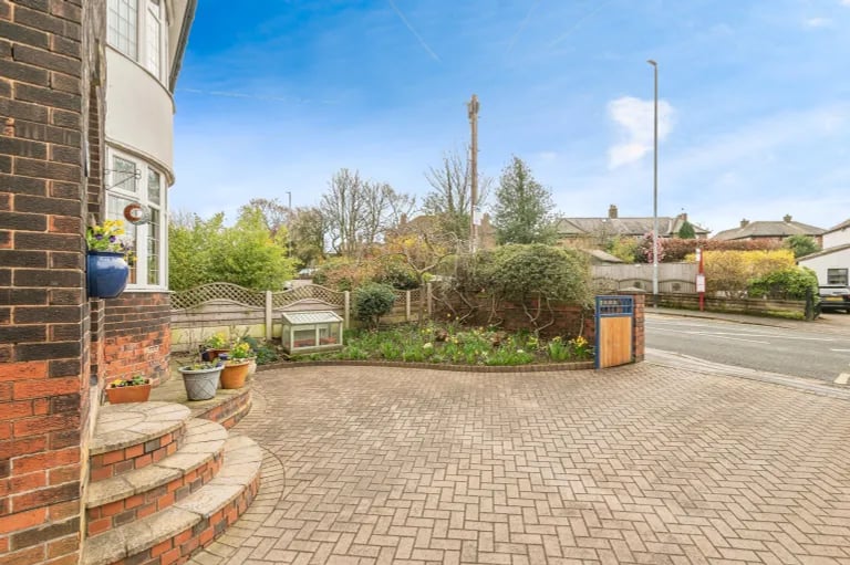 Externally, a large driveway sits to the front for lots of parking space along with a small garden area.