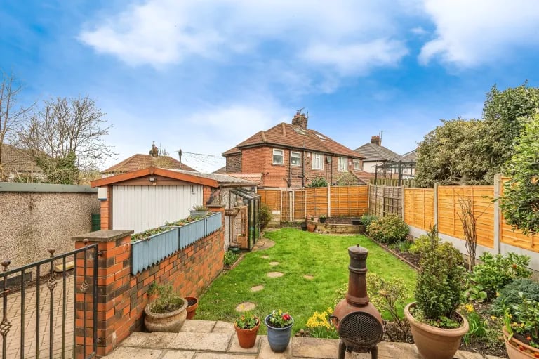 A patio area overlooks the garden and offers plenty of space for furniture.