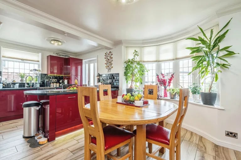 Here is also a large dining area with bay window overlooking the rear garden.