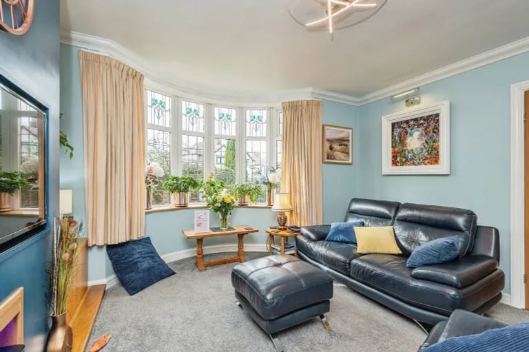 Designed for comfort, this colourful room is flooded with natural light from the large bay window overlooking the front elevation.