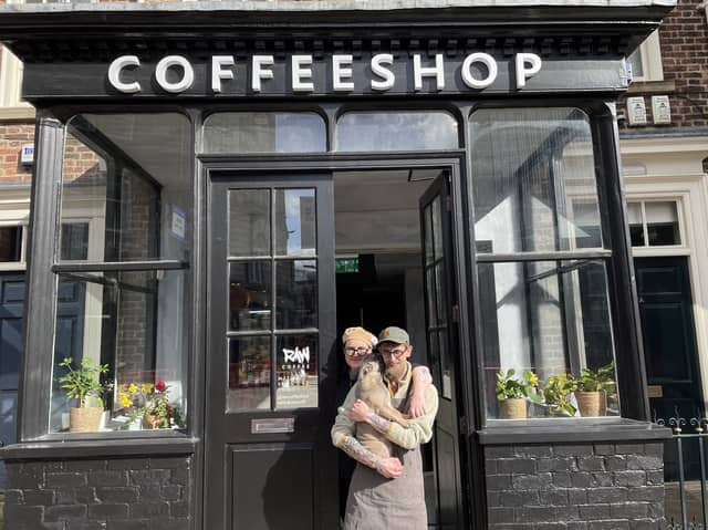 Raw Coffee, Mill Hill, opened to the public on March 20. Pictured are the owners, husband and wife Anya Adams and James Adams with their dog.