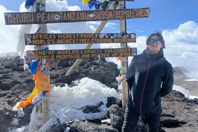 Jonathan at the summit of Mount Kilimanjaro.