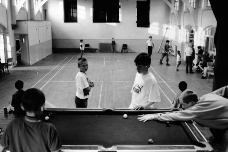 Youngsters enjoy a game at the youth club at St. Johns Church Hall. The was facing demolition in July 1994.