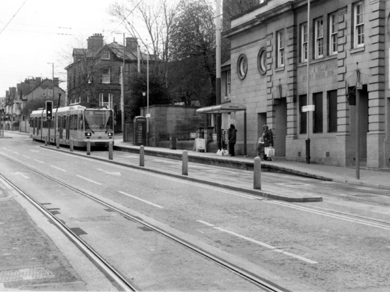Supertram number 9 approaches the Hillsborough stop, on Langsett Road, with the former Hillsborough Baths on the right, in May 1996