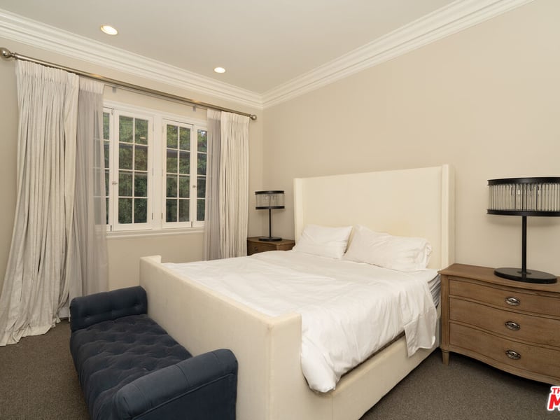 Another one of the many bedrooms inside the 722 North Elm Drive residence (Credit: The MLS)