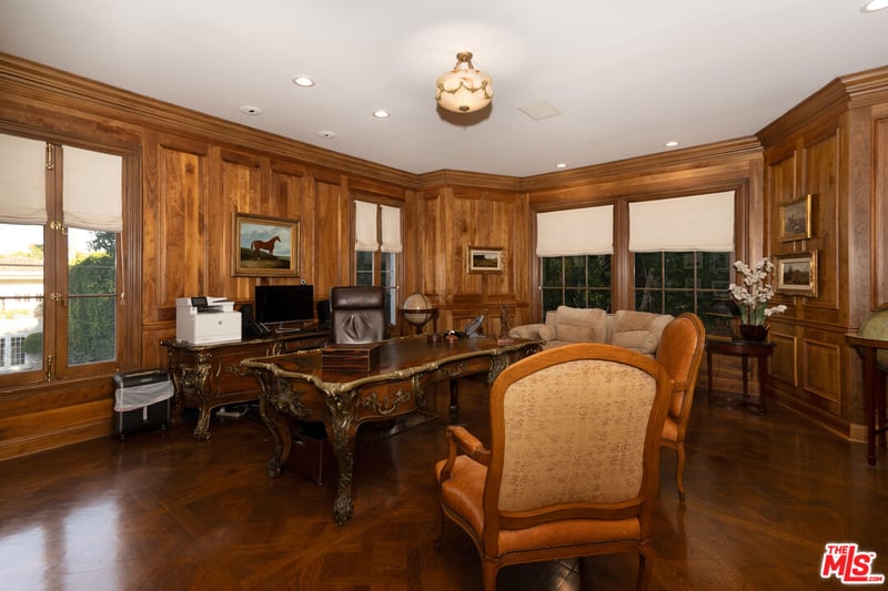The regal looking study, with its grandeur wooden walls and timeless decor (Credit: The MLS)