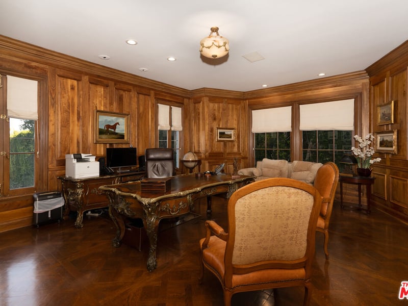 The regal looking study, with its grandeur wooden walls and timeless decor (Credit: The MLS)