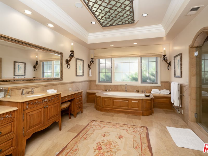 The enviable size of the master bathroom at the former home of the Menendez family - including a bathtub almost the size of a hot tub (Credit: The MLS)
