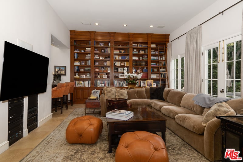 While lounges usually are the place people gather to watch TV, in this property an Entertainment Room, complete with bookshelf, seems to be the place to catch up on true crimes series (Credit: The MLS)