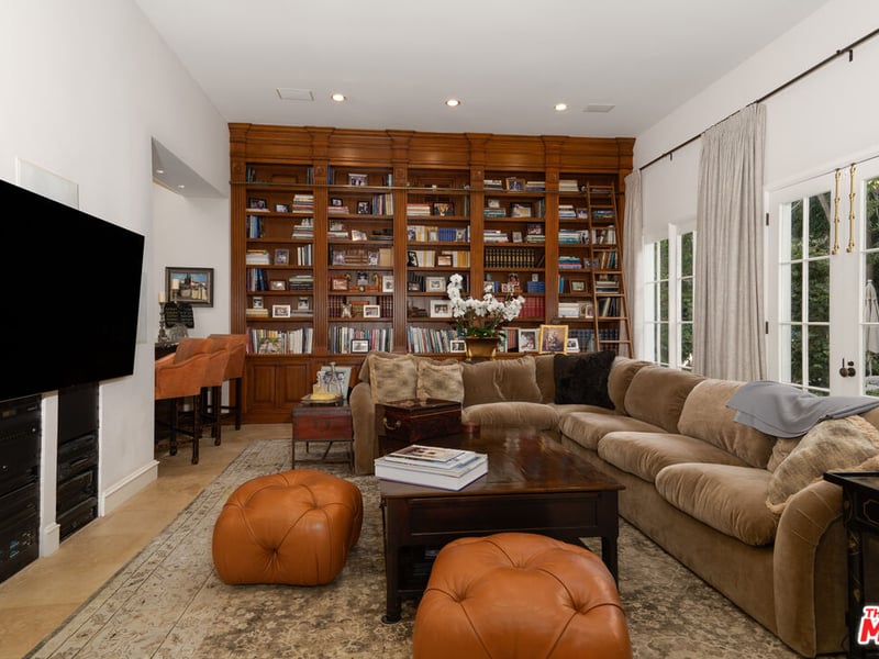 While lounges usually are the place people gather to watch TV, in this property an Entertainment Room, complete with bookshelf, seems to be the place to catch up on true crimes series (Credit: The MLS)