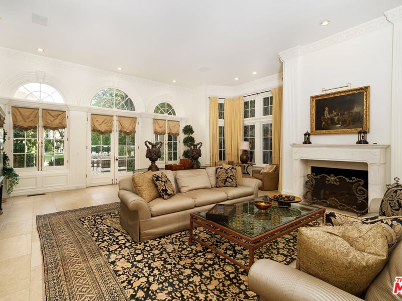 The lounge/living area, with french doors leading to the spectacular backyard of the property (Credit: The MLS)