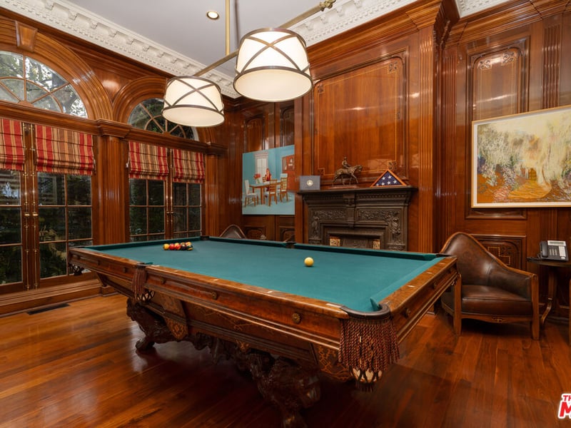While some games rooms may have arcade cabinets, the Menendez mansion eschews modern technology in this instance for the more tradition games of billiards and cards (Credit: The MLS)