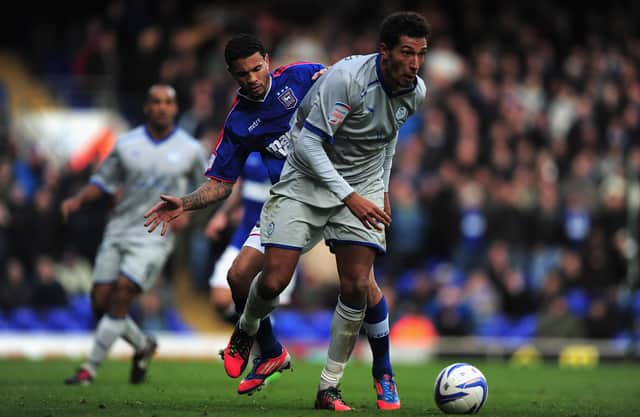 Carlos Edwards  of Ipswich Town battles with Jay Bothroyd of Sheffield Wednesday during the npower Championship match between Ipswich Town and Sheffield Wednesday at Portman Road on October 27, 2012 in Ipswich, England.  (Photo by Jamie McDonald/Getty Images)