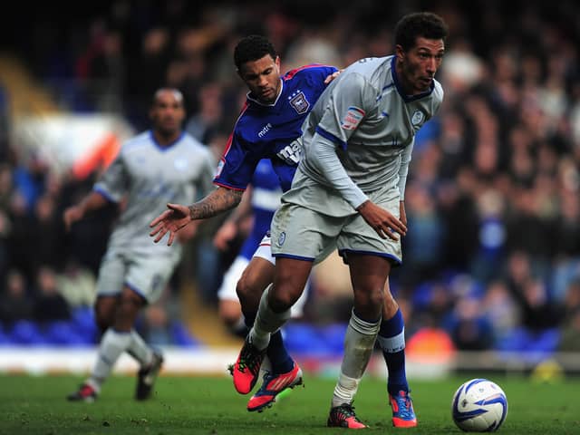 Carlos Edwards  of Ipswich Town battles with Jay Bothroyd of Sheffield Wednesday during the npower Championship match between Ipswich Town and Sheffield Wednesday at Portman Road on October 27, 2012 in Ipswich, England.  (Photo by Jamie McDonald/Getty Images)